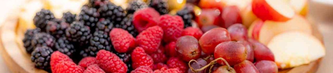 tn_red-and-black-berries-on-brown-wooden-plate